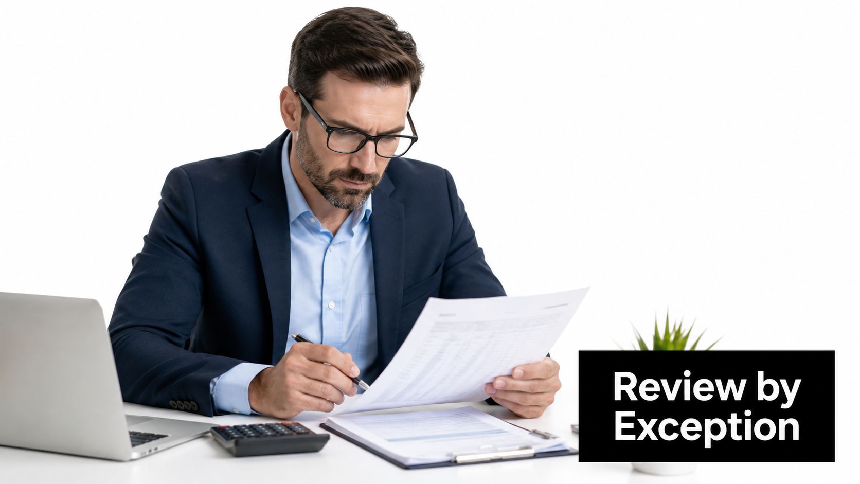 A professional businessman reviewing tax forms at his desk with a laptop and calculator in a studio.